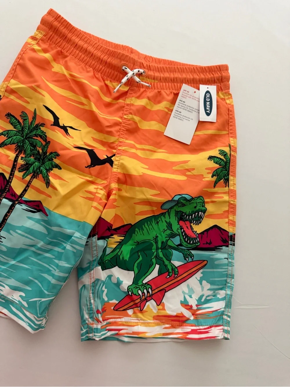 (NWT) Old Navy Boy’s Dinosaur 🦖 Swim Trunks in Orange/Multi, Large (10/12)